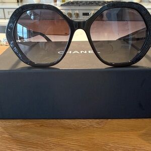 CHANEL Black Sunglasses with Gold Accent and black sequins on side.
